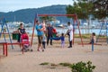 Children play in sunny summer city park on the seafront Royalty Free Stock Photo